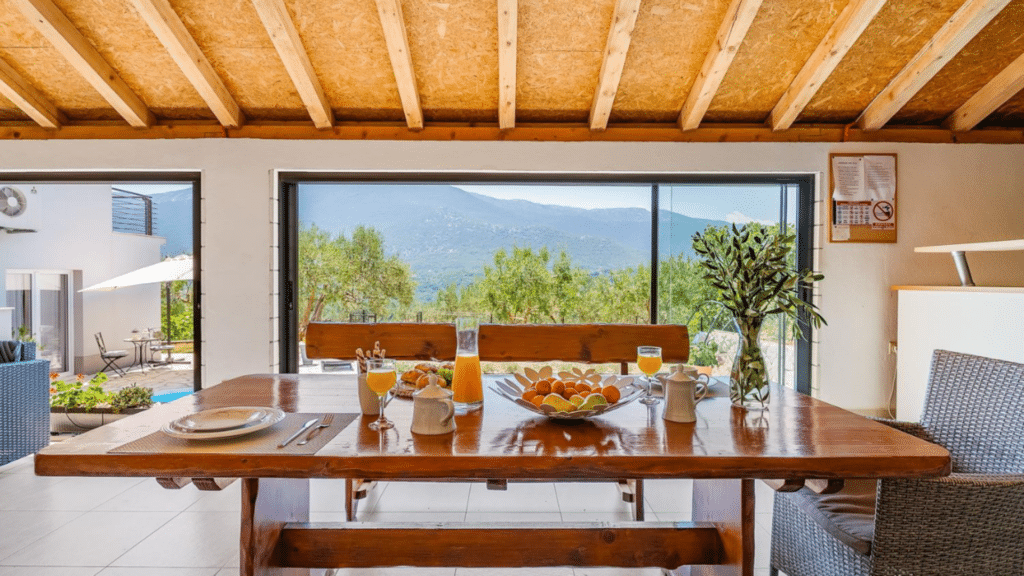 Outdoor dining area with panoramic valley views at a private villa in Omis, Croatia