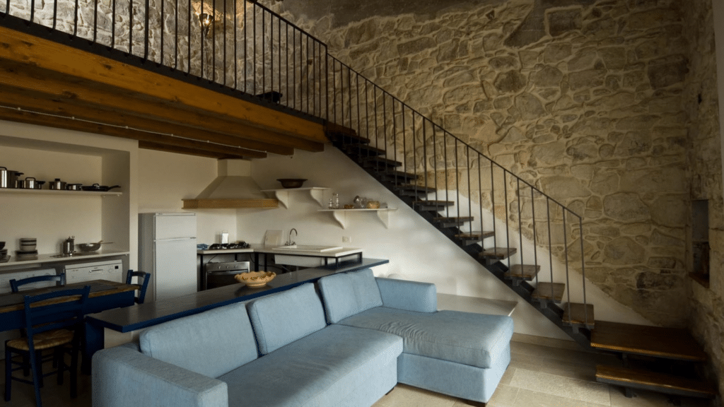 Spacious living room inside a restored private country estate in Sicily.