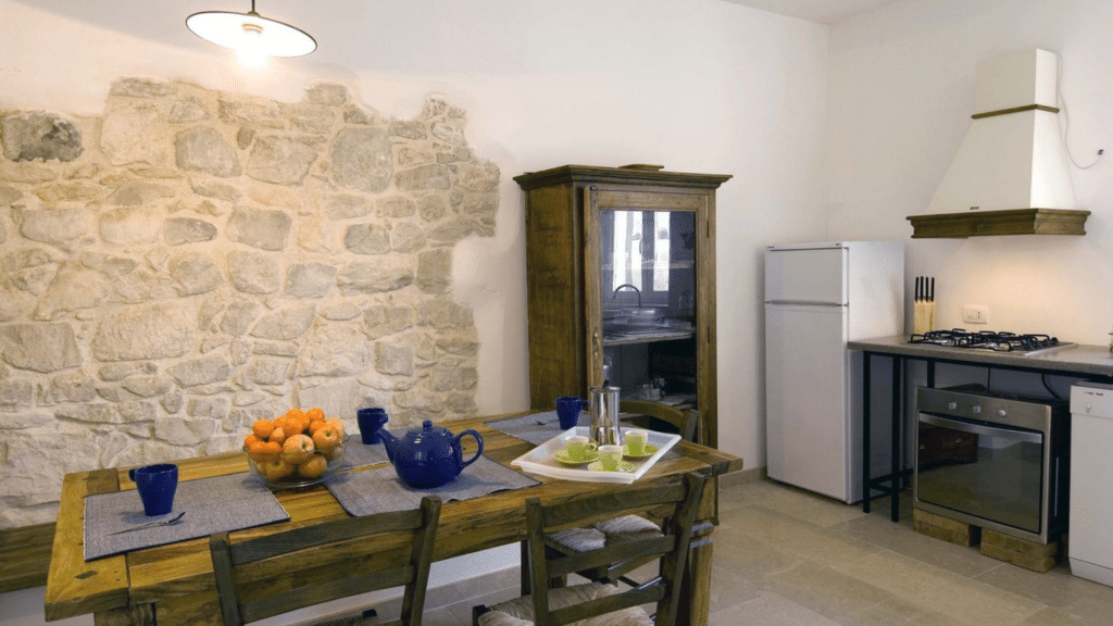 kitchen and dining area inside a private Sicily country estate for the Sicilian Sunsets experience.