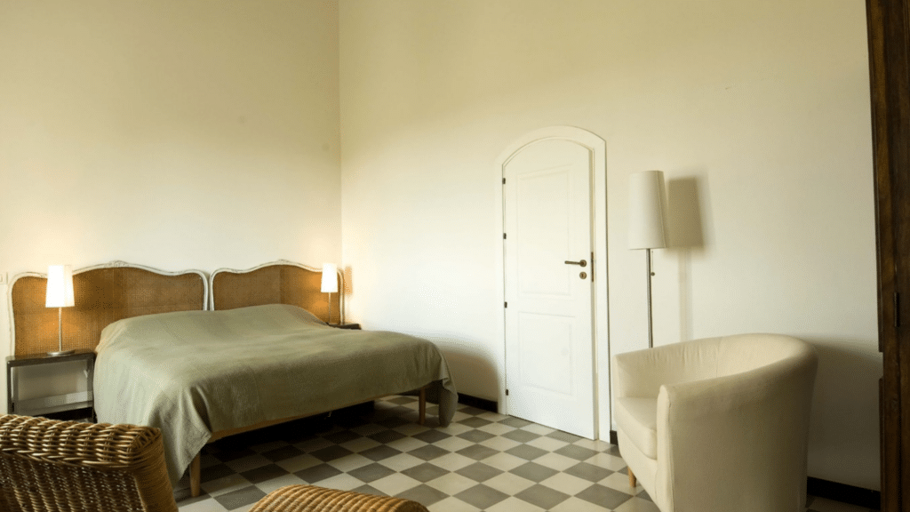 Comfortable bedroom inside the private Sicily country estate included with the experience.
