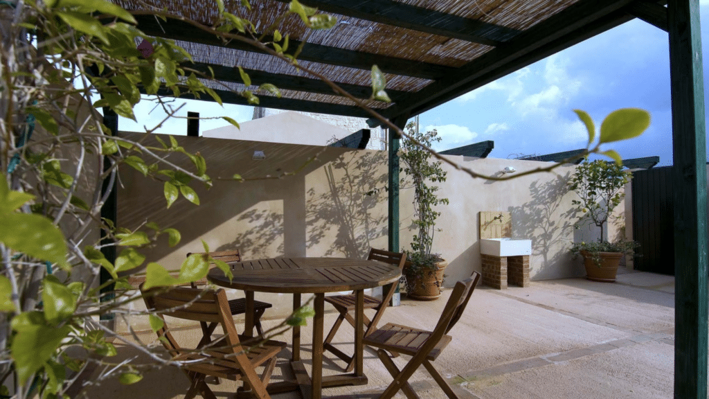 Private outdoor patio at a Sicily country estate surrounded by peaceful countryside.