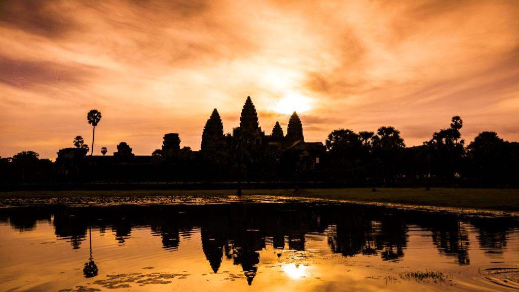 Sunset over Angkor Wat reflecting across the surrounding water