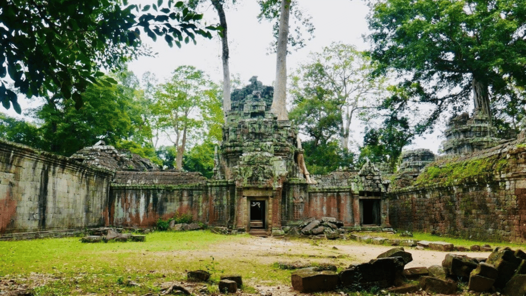 Historic temple ruins surrounded by lush forest in Angkor Archaeological Park
