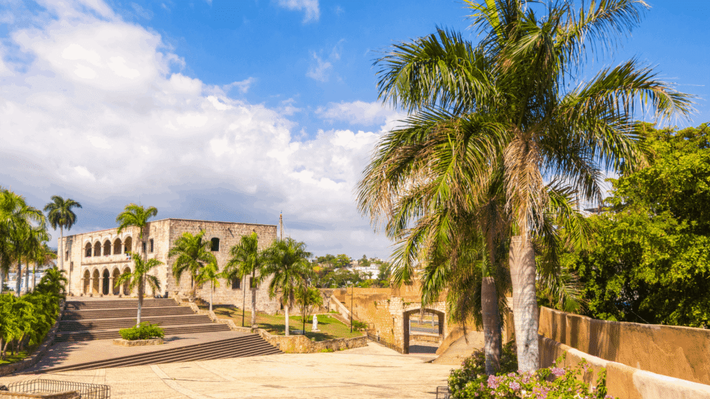 Alcázar de Colón surrounded by palms in Santo Domingo