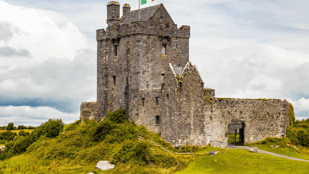 Close view of historic Dunguaire Castle surrounded by green countryside near Galway, Ireland