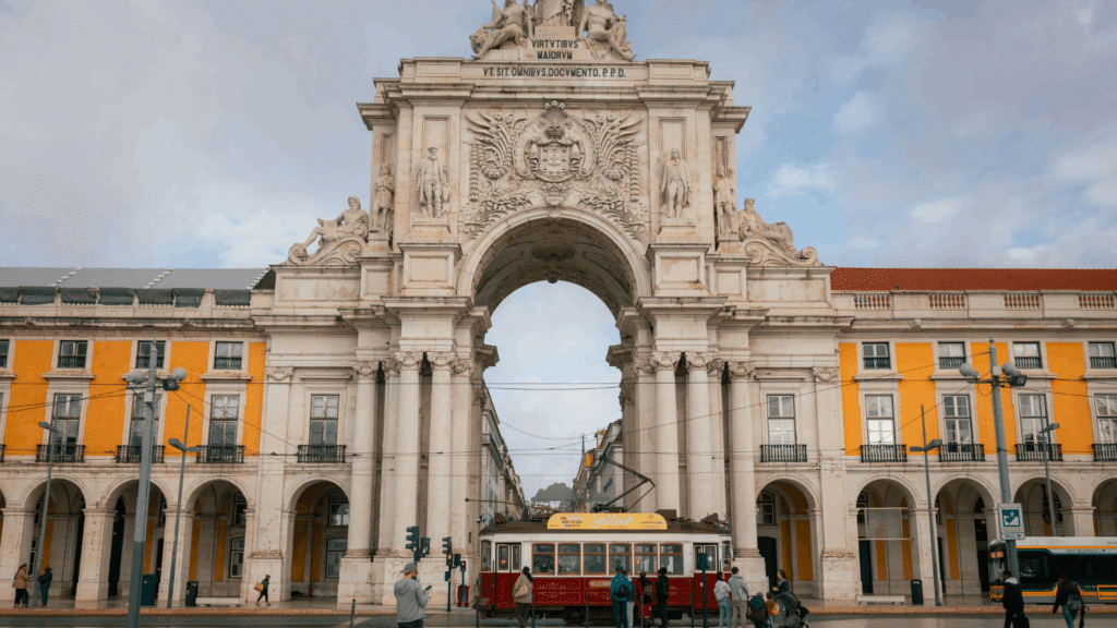 Rua Augusta Arch with a historic tram at Praça do Comércio in Lisbon, Portugal