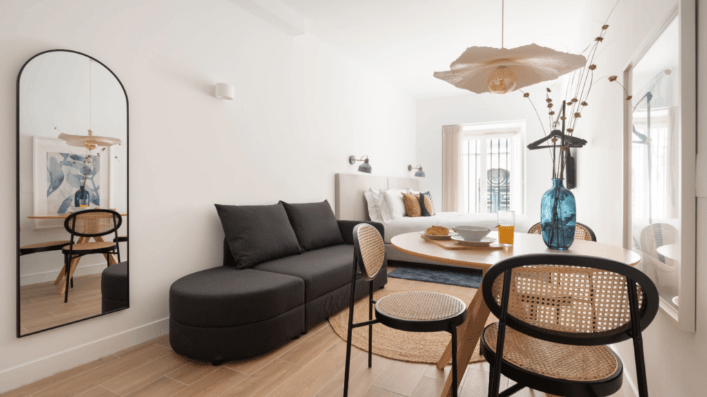 Modern living and dining area in private Lisbon studio residence